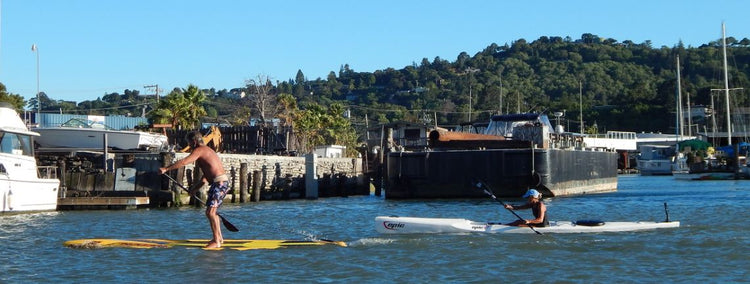 Maddy King on the epic v7 surfski being nipped at the line by Davidf hook on the Naish Maliko