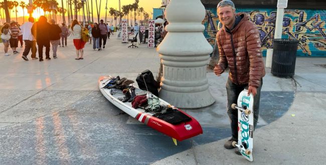 Peter Steinfath in santa monia with SIC SUP and skateboard