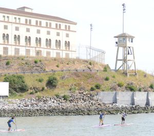 John Becker leads Jean Rathle and Brian Szymanski by the San Quentin Guard Towers