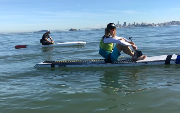 Sitting on a board on the bay!