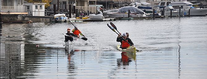 Carter Johson bringing the double surfski in just in front of Kenny Howell and Mike Mcnulty