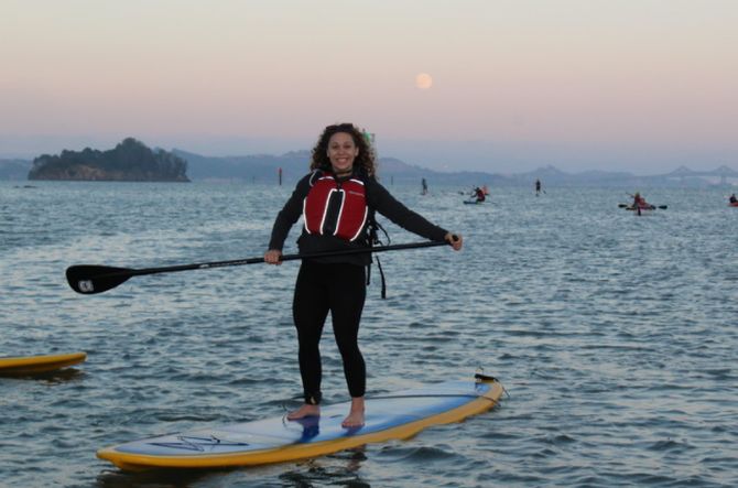 A Stand up paddleboard enjoying our full moon moonlight paddle tour