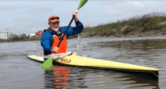 nicholas goulden paddles to raise money for the float house. 