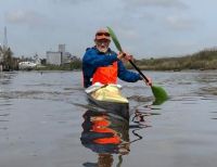 nicholas goulden paddles to raise money for the float house. 