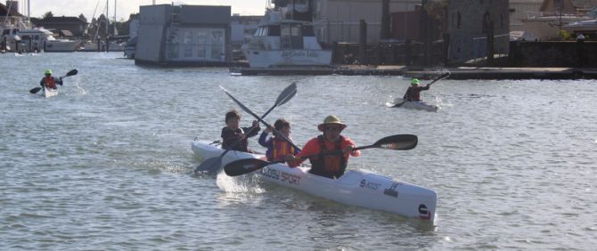 Mike Staninec and family on the triple surfski