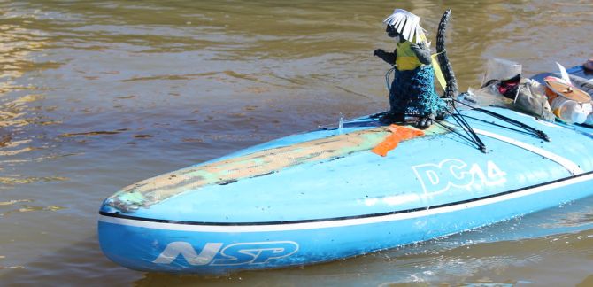 Stand up paddleboard racing on San Francisco bay with Godzilla